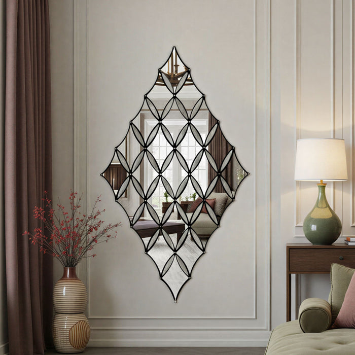 Decorative wall mirror with geometric design in a living room setting.