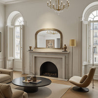 antique gold mirror above a fireplace