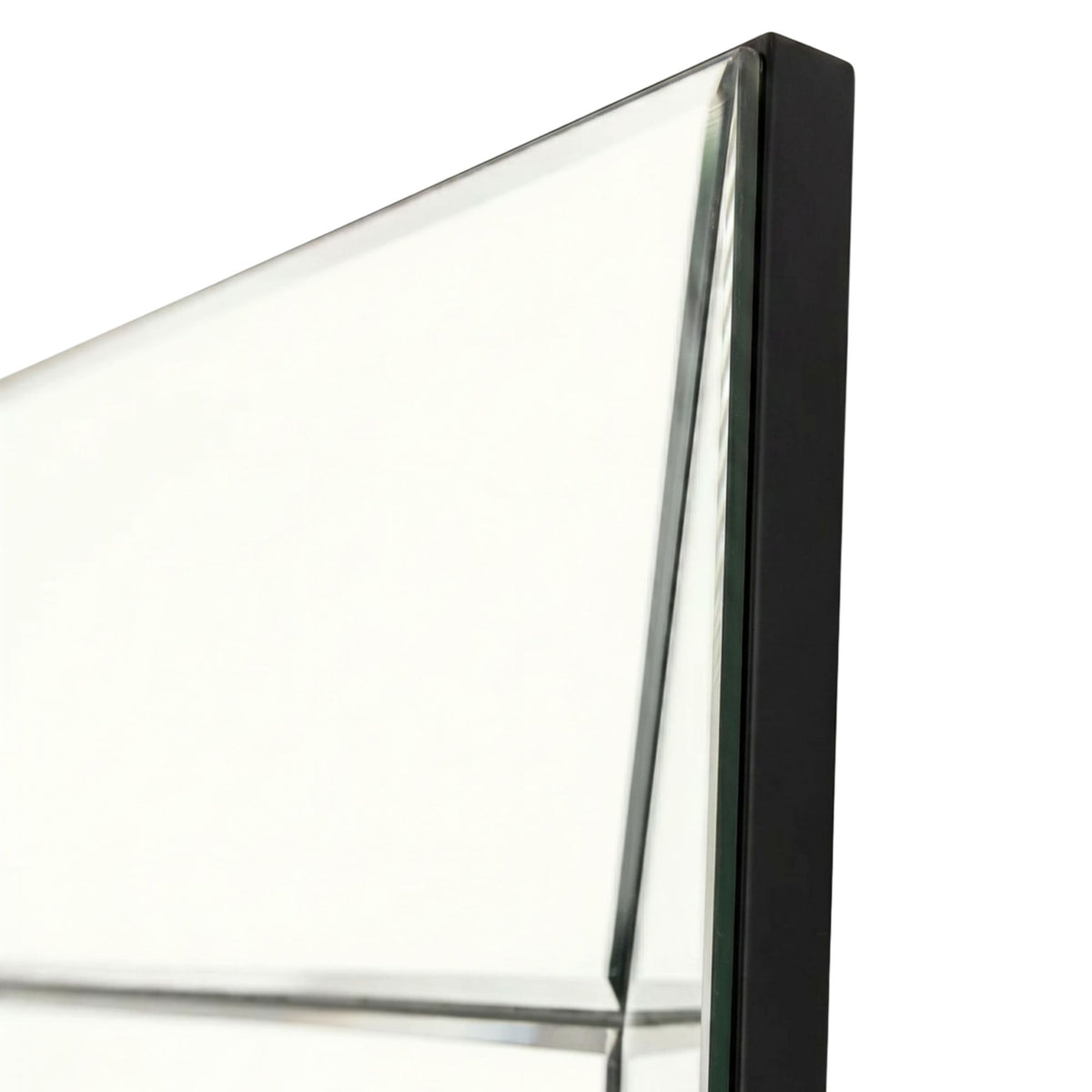 Close-up of a glass panel with a black frame on a white background