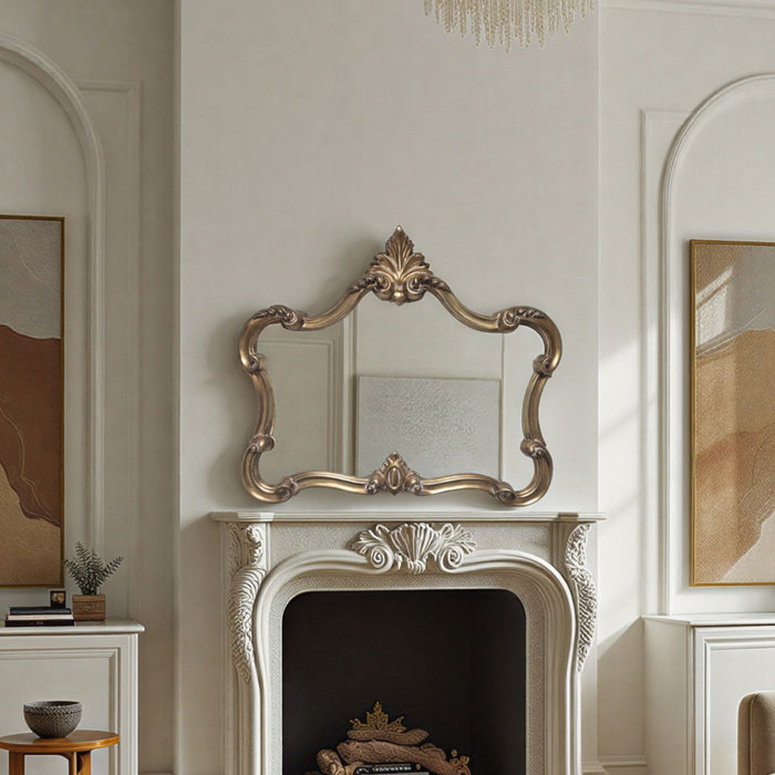Decorative mirror on a fireplace mantel in a stylish room with framed artwork.