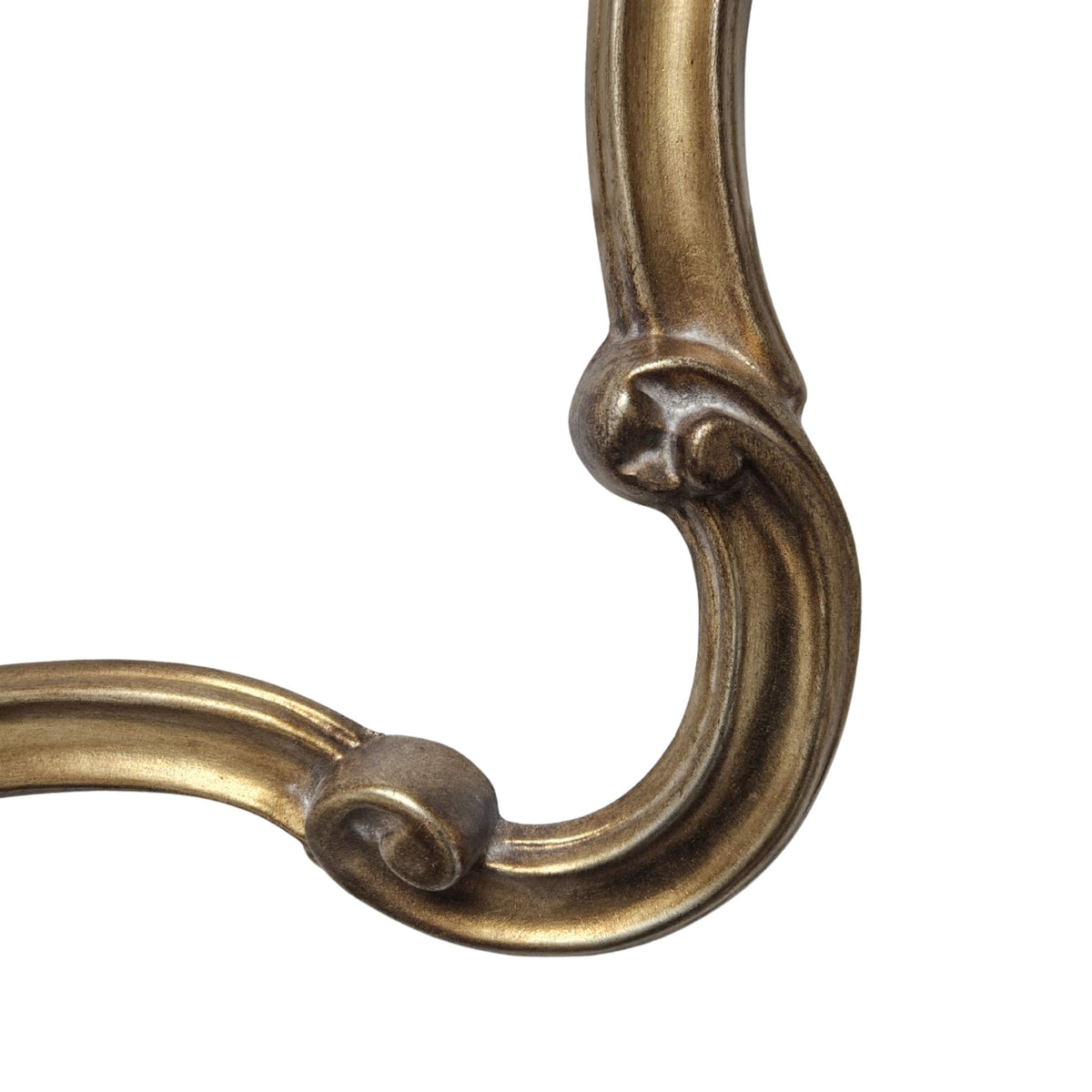 Close-up of a decorative bronze handle on a white background