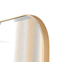Gold-framed mirror on a white background